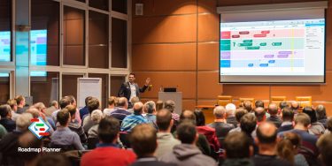 Meeting in an educational institution. Man showing presentation with Roadmap Planner