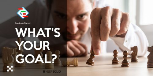 Businessman brainstorming his goals as he creates business strategy by placing black and white chess pieces on office desk