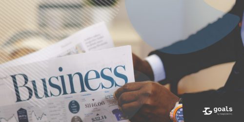 Businessman reading a paper, looking for insights on external opportunities