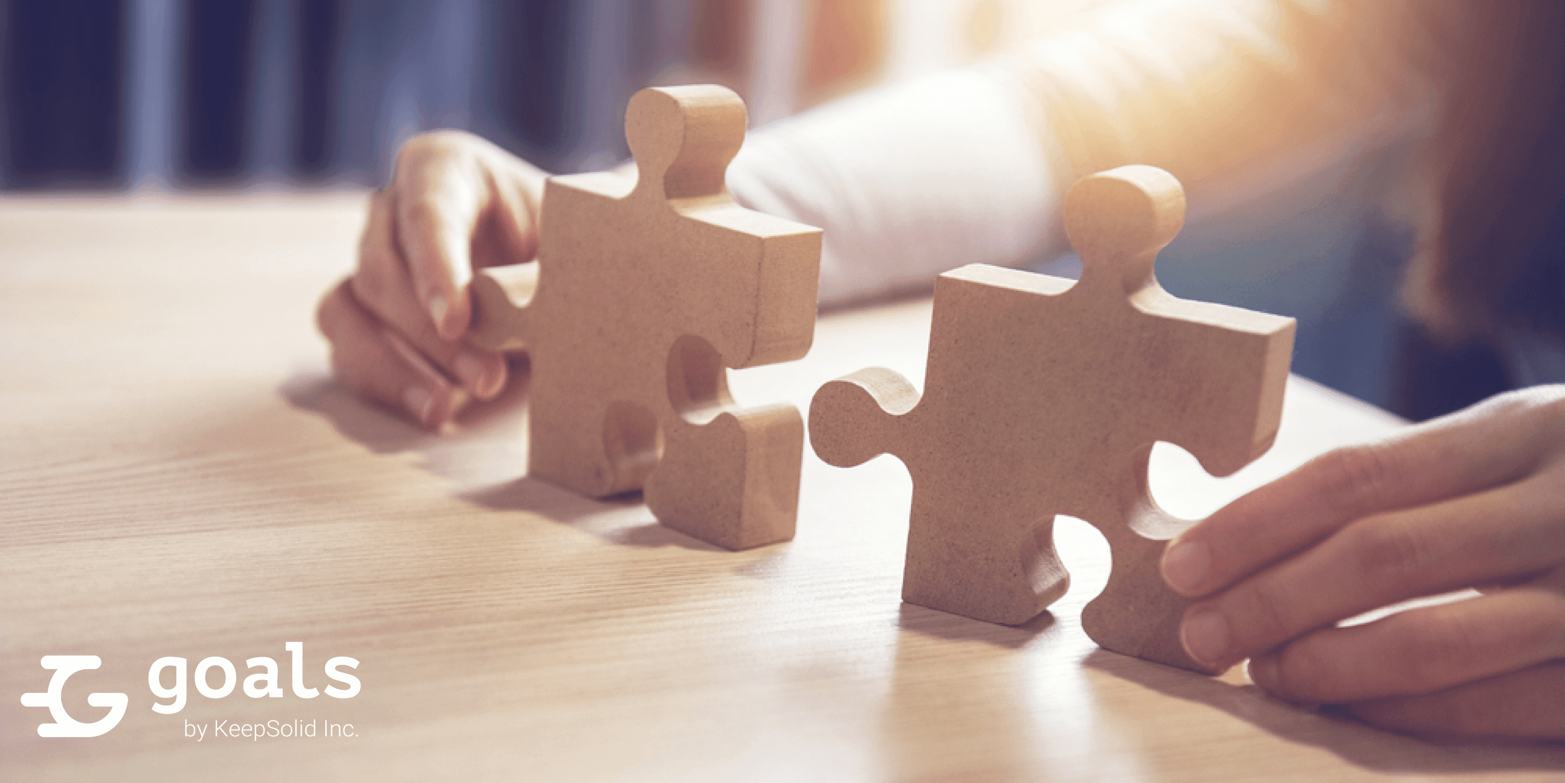 Connecting jigsaw puzzle on desk, success and strategy concept