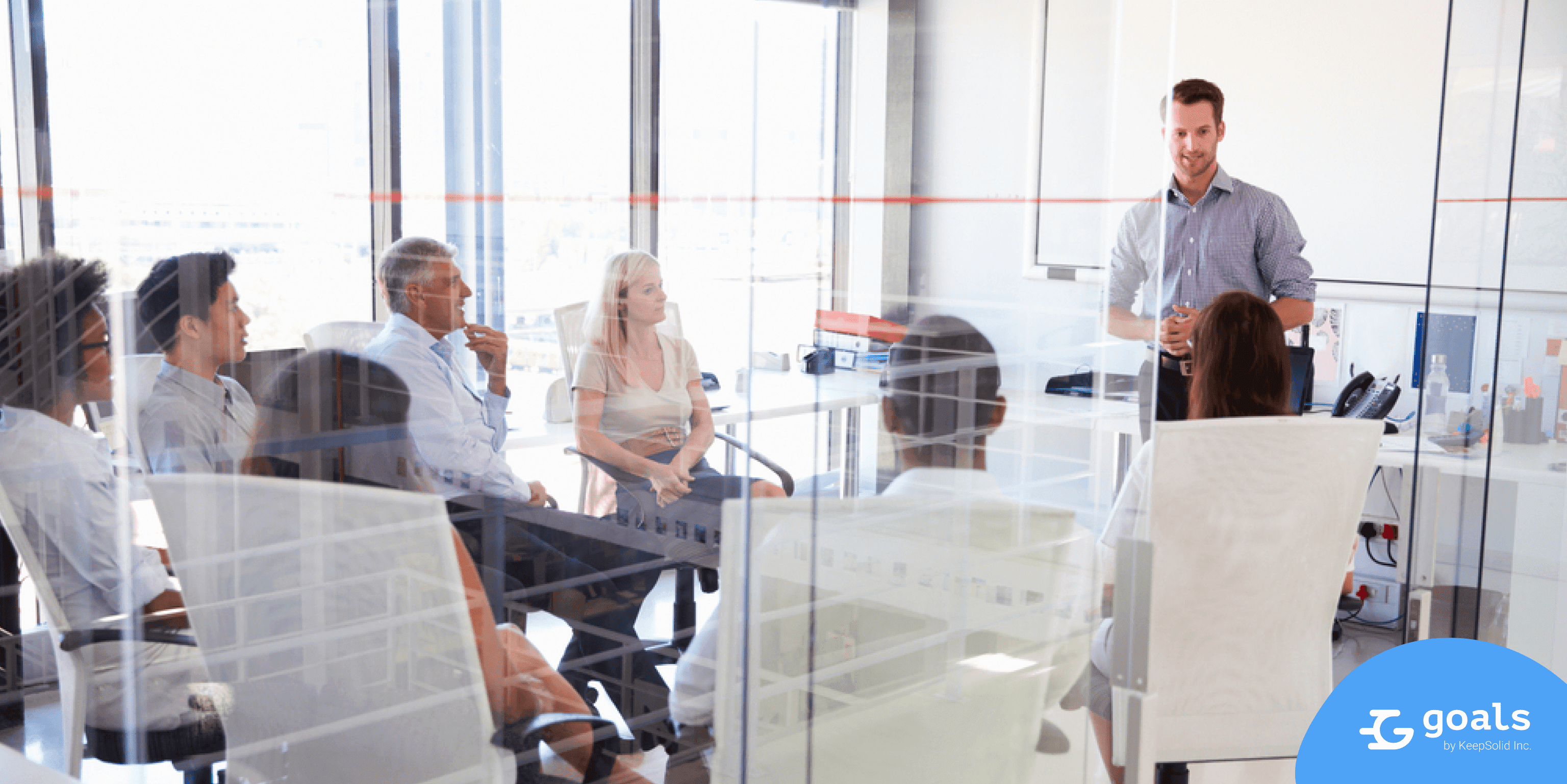 Business meeting, an employer is recording minutes of the meeting using KeepSolid Goals